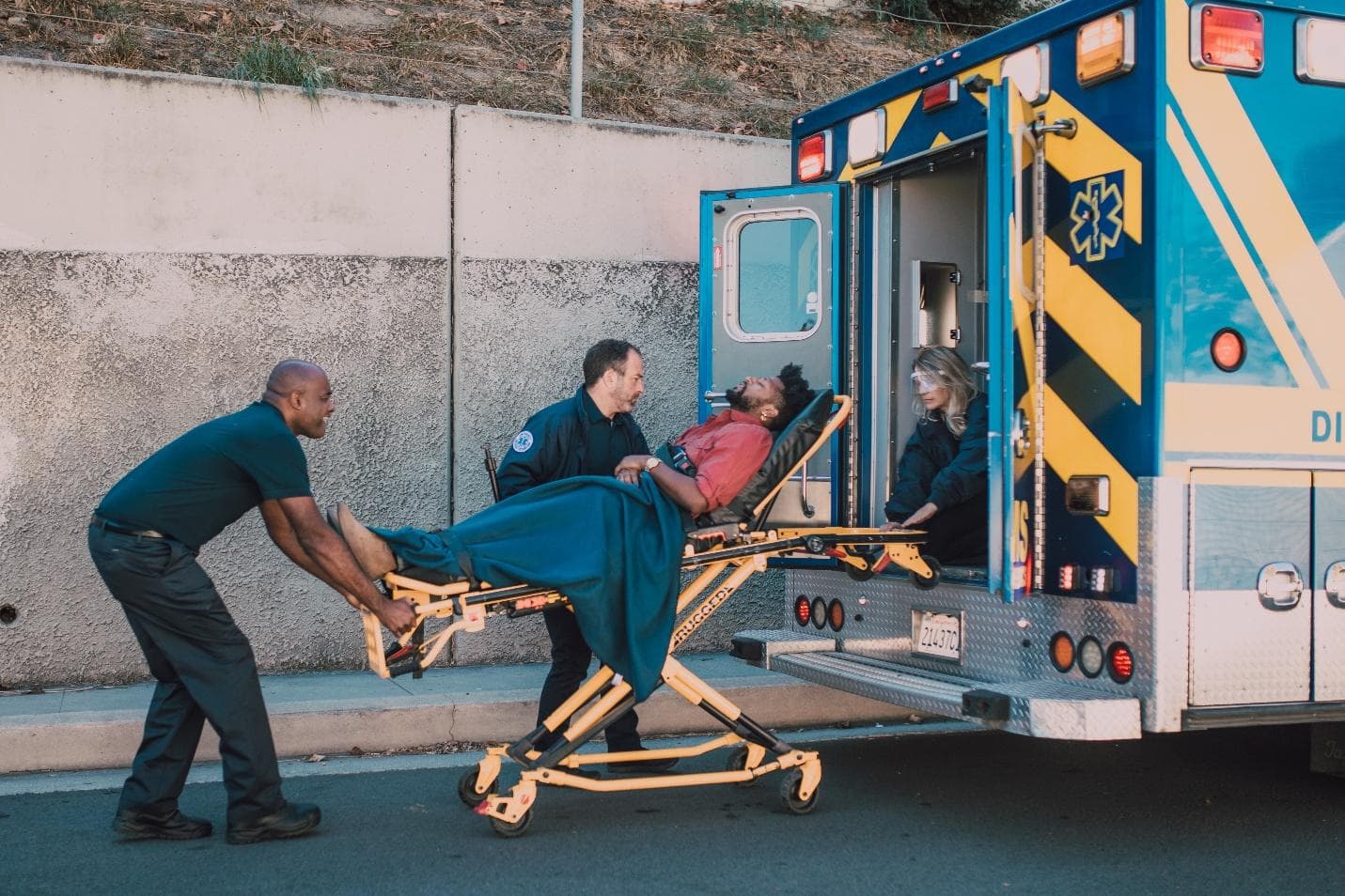 Paramedics Taking Injured Man to Hospital
