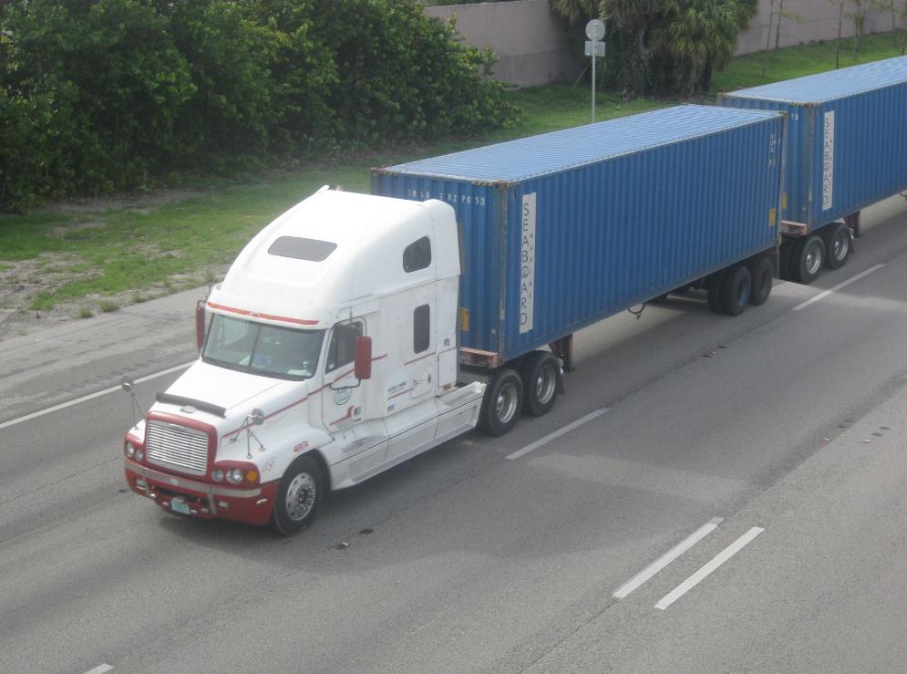 A double trailer truck on the road