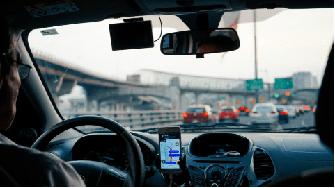 rideshare driver following the map to drop off a passenger