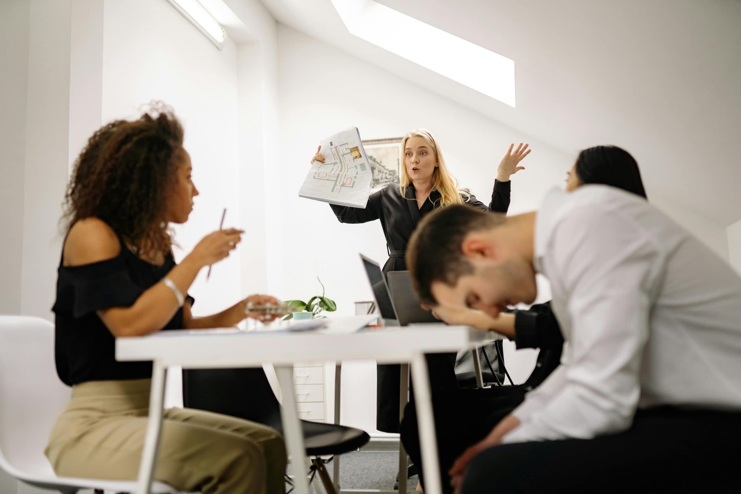 Employees at an office struggling with Unlawful Retaliation for Accommodation Requests.