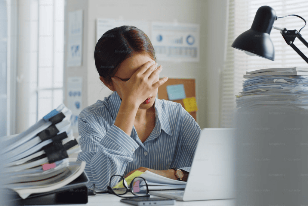 Tired office employee feeling stressed probably due to her wrongful termination