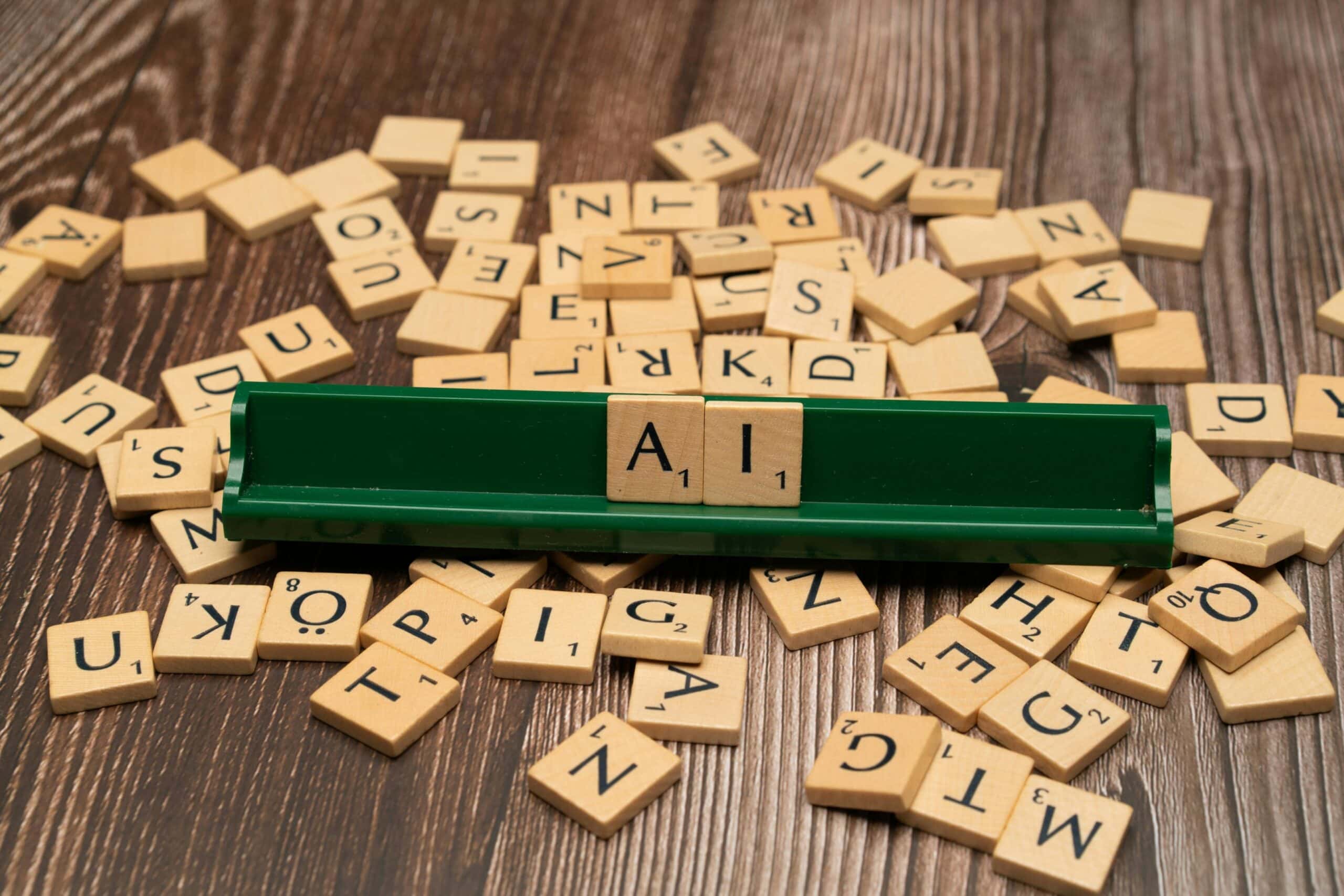 Scrabble tiles spelling AI to shed light on Biased AI Hiring Tools.