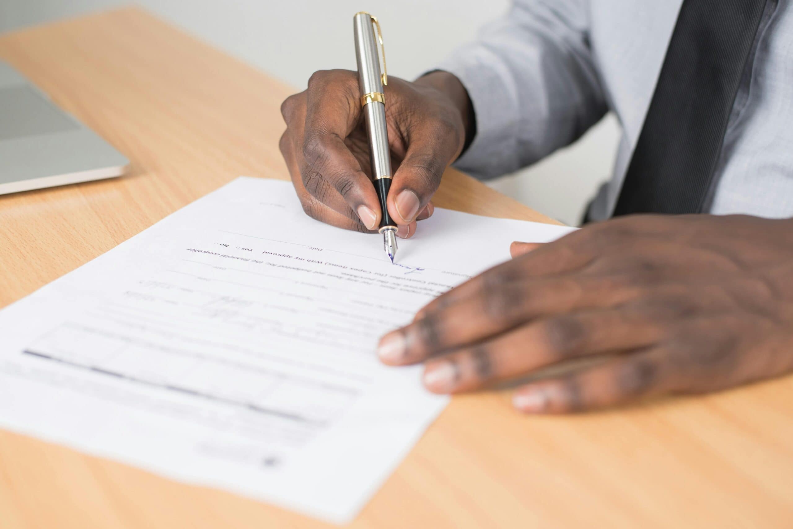 An individual signing an employment contract.